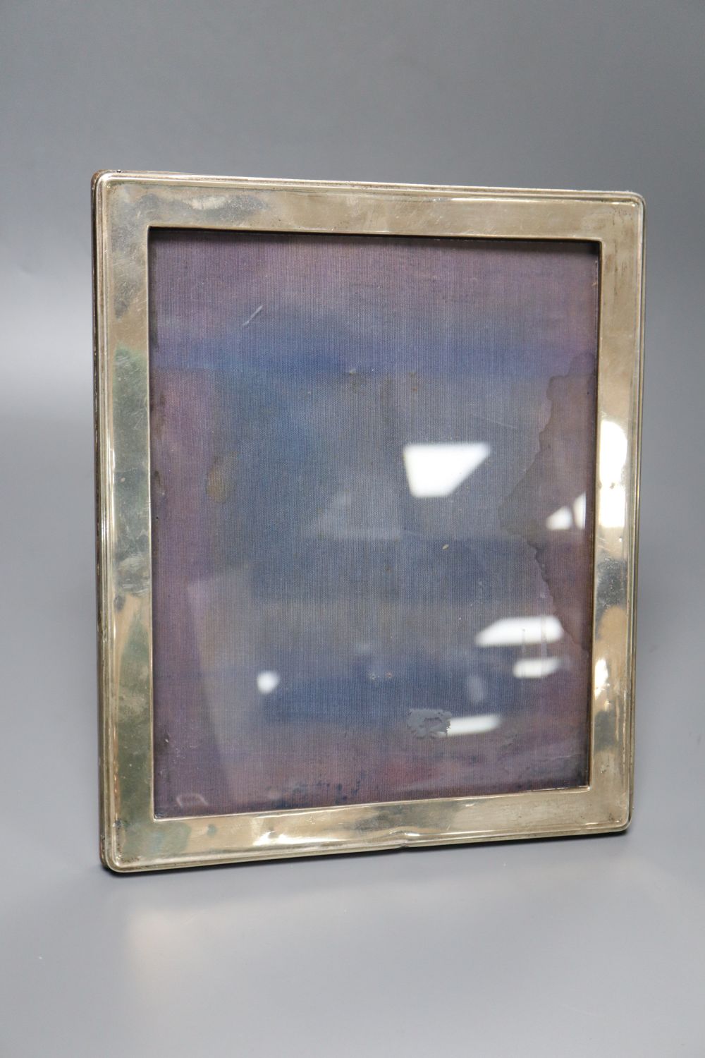 A George V silver mounted rectangular photograph frame, A & J Zimmerman, Birmingham, 1917, 30cm.